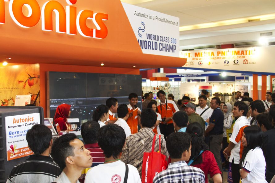 Exhibitor Autonics draws large crowd for their demonstration of latest industrial automation technology.
