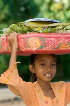 Traditional Indonesian Girl Carrying Produce on her head